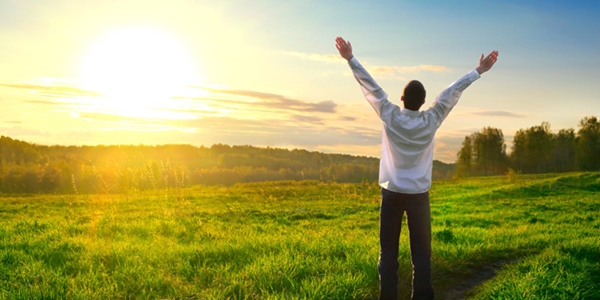 happy man with hands up on sunset background; Shutterstock ID 100173191; PO: aol; Job: production; Client: drone